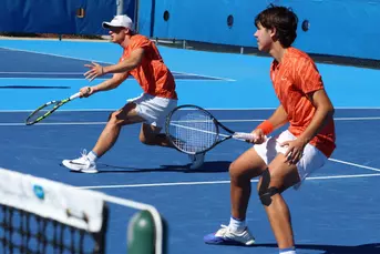 Kevin Edengren and Andreas Timini playing the net during doubles against FGCU.