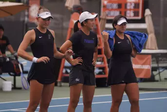 Nikola Daubnerova, Xinyi Nong and Valery Gynina look on during the Gators' match at Texas