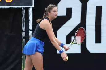 India Houghton serving against No. 2 Texas A&M