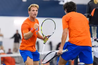 Kevin Edengren celebrates with teammate Andreas Timini at the indoor court.
