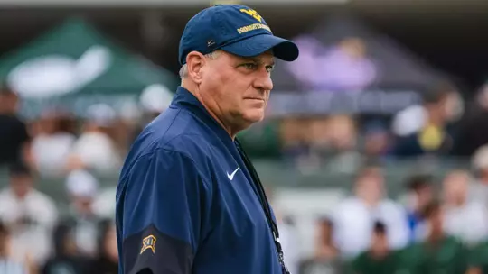 Head coach Rich Rodriguez looks on as the Mountaineers prepare for their game against Ohio in Athens, Ohio, on Sept. 6, 2025.