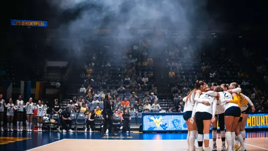 The WVU Volleyball is huddled up before its match against TCU on Sept. 27