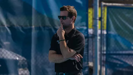 Head Coach Miha Lisac watching a match against UCF during the 2025-26 season