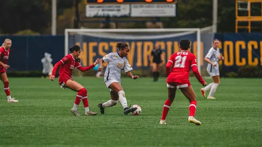 Layla Thompson dribbles the ball during a match at Dick Dlesk Soccer Stadium.