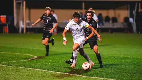 Pablo Pozos battles for the ball against South Carolina