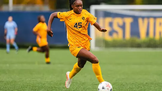 Tyler Clyburn passes the ball during a game at Dick Dlesk Soccer Stadium.