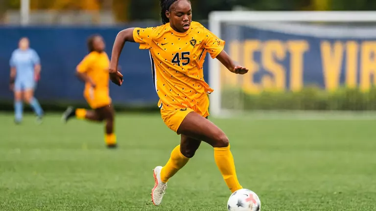 Tyler Clyburn passes the ball during a game at Dick Dlesk Soccer Stadium.