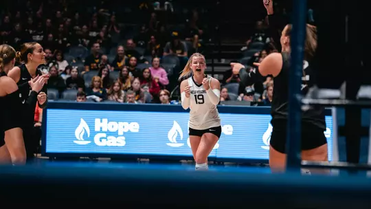 Reagan Turk celebrates after a point against Cincinnati on Oct. 16