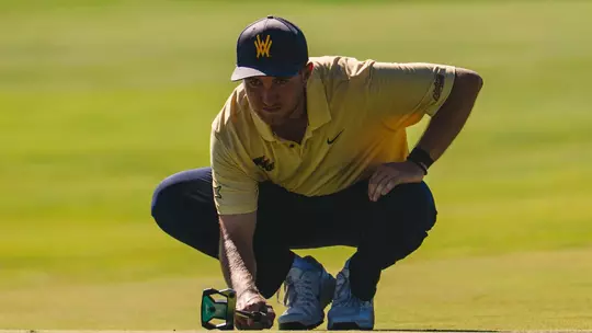 Jack Michael lines up a putt during the Nemacolin Invitational.