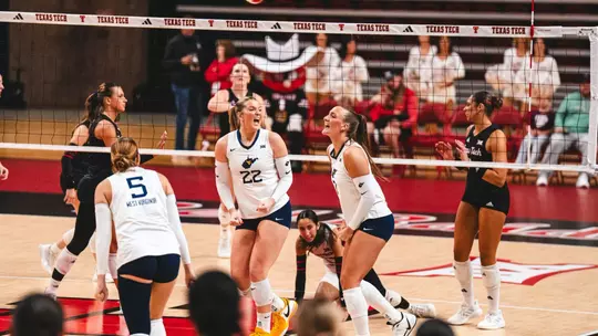 Anna Barr celebrates after winning a point against Texas Tech on Oct. 2