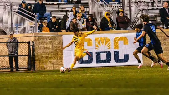 Tyler Londono Zapata kicks the ball against Kentucky