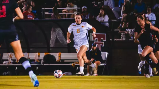 Maya Leoni dribbles a ball down the field at John Walker Soccer Complex in Lubbock, Texas.