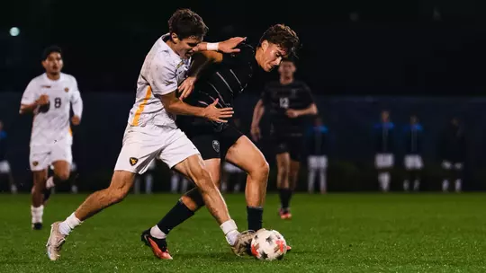 Isaac Scheer battles for the ball against South Carolina