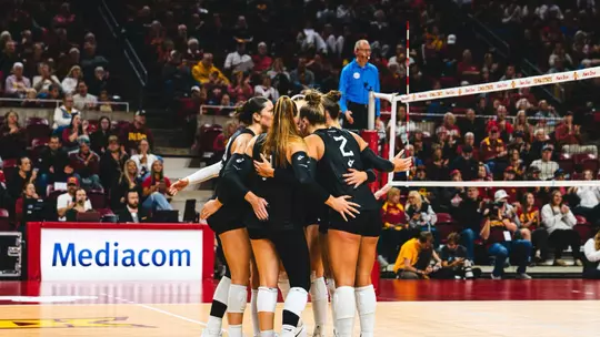 WVU Volleyball huddles before a point versus Iowa State