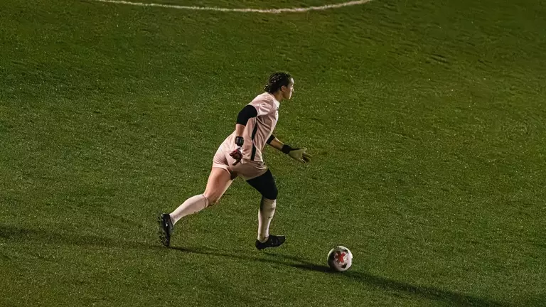 Bailey Herfurth dribbles a ball during a match at Dick Dlesk Soccer Stadium.