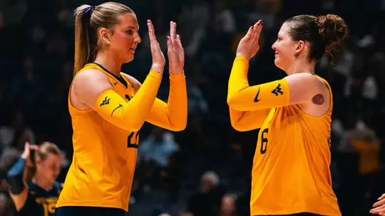 Maddy McGath and Saar Bertels high five during the Houston Match