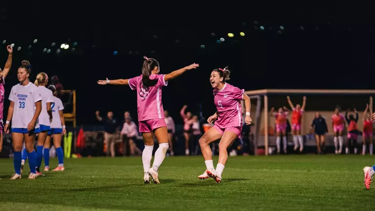 Sophia Nickel and Maya Leoni celebrate after a goal.