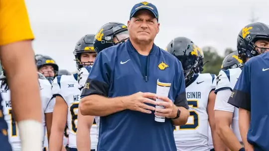 Head coach Rich Rodriguez prepares to take the field with the Mountaineers against Ohio in Athens, Ohio, on Sept. 6, 2025.