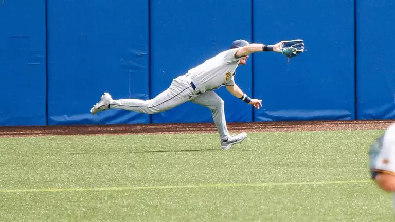 Centerfielder Paul Schoenfeld extends to make a great diving catch in West Virginia's 4-1 victory over ninth-ranked Kansas at Hoglund Ballpark in Lawrence, Kansas, on Friday, May 8, 2026.