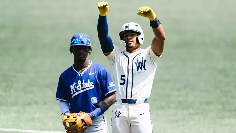 Armani Guzman celebrates after a base hit against Kansas State