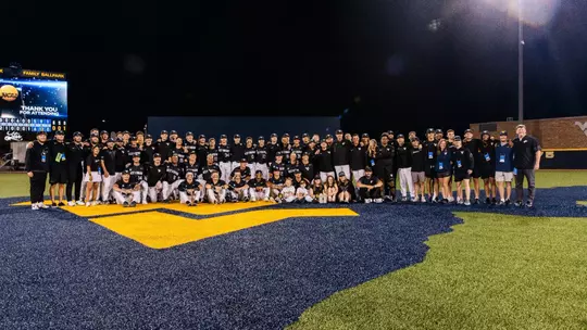 The West Virginia baseball team poses for a photo after winning the Morgantown Regional