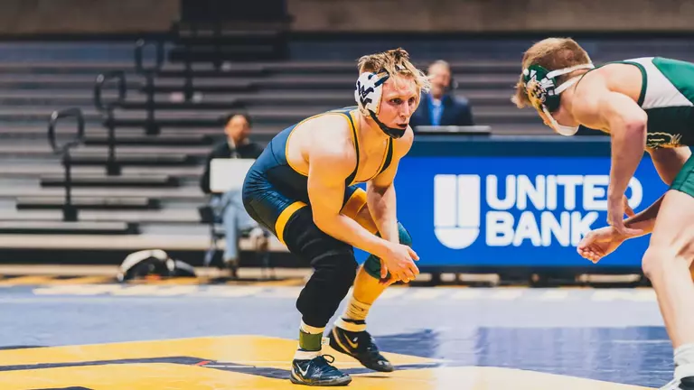 Killian Cardinale competes against a wrestler from Ohio University in a match at Hope Coliseum for WVU wrestling.