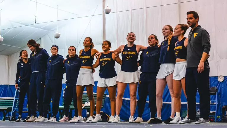 The tennis team sings Country Roads after a win against Cincinnati