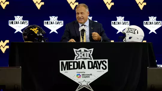 West Virginia coach Rich Rodriguez discusses his team at 2025 Big 12 Media Days at The Star in Frisco, Texas.