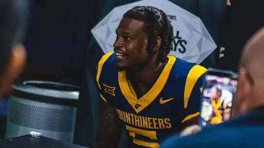 West Virginia University football player Jaden Bray talks to media during Wednesday's Big 12 media day at The Ford Center in Frisco, Texas.