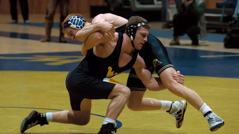 Mike Mason wrestled for the Mountaineers in the 1990s, becoming a two-time All-American.