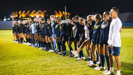 The WVU women's soccer team celebrates a win over Penn State Thursday night.