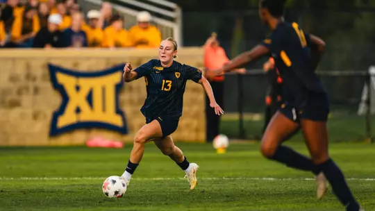 Anna Hauer of the WVU women's soccer team dribbles down the field during a match on Aug. 20.