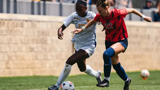 Tyler Clyburn battles for a ball during a match against Duquesne on Aug. 23.