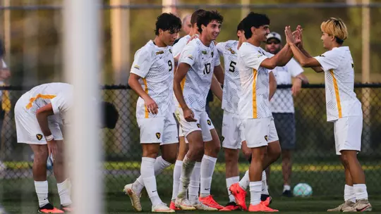 The WVU Men's soccer team celebrates after scoring a goal against St. Bonaventure