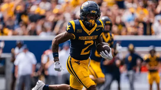 DJ Epps catches a 53-yard touchdown pass from Michael Hawkins in the first quarter of West Virginia's game against UT Martin at Milan Puskar Stadium in Morgantown, West Virginia
