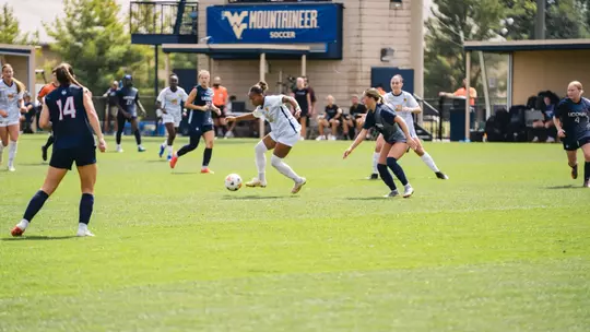 Layla Thompson dribbles the ball during a game at Dick Dlesk Soccer Stadium.