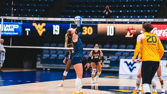 Reagan Turk sets the ball against Lehigh
