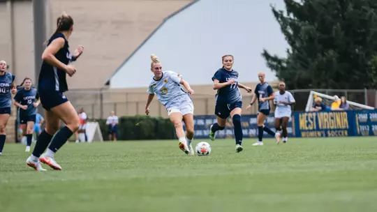 Anna Hauer passes a ball during a game at Dick Dlesk Soccer Stadium on Sept. 13.