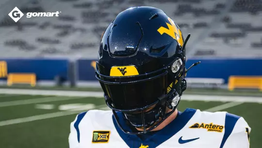 West Virginia will wear a blue helmet, white jersey and blue pants against No. 25 Virginia in Charlotte, N.C., on Sept. 19, 2026.