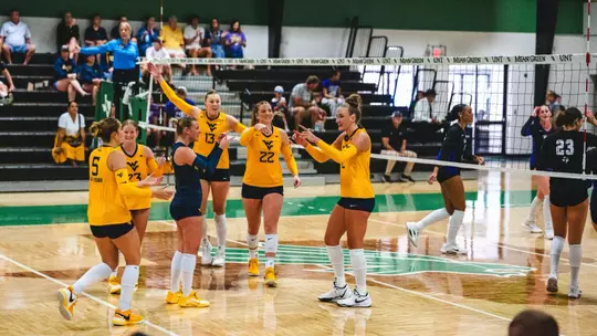 Anna Barr finishes a kill while playing against Tarleton State in the UNT Invitational