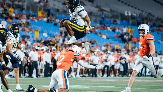 Quarterback Michael Hawkins Jr. (3) scores a rushing touchdown in the first quarter against No. 25 Virginia at Bank of America Stadium on Sept. 19, 2026, in Charlotte, N.C.
