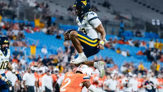 Quarterback Michael Hawkins Jr. (3) scores a rushing touchdown in the first quarter against No. 25 Virginia at Bank of America Stadium on Sept. 19, 2026, in Charlotte, N.C.