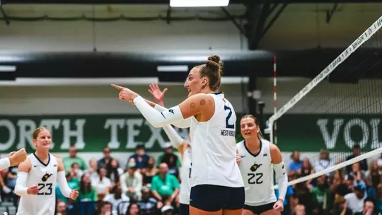 Anna Barr celebrates following a point during the North Texas Invitational