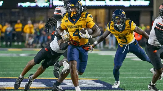 Cam Cook rushes against Oklahoma State at Milan Puskar Stadium in Morgantown, W.Va., on Sept. 26, 2026.