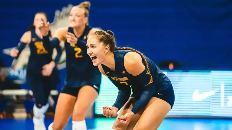 Mirjam Kask celebrates following a point during a match.