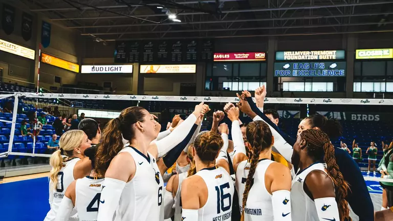 WVU Volleyball Team Huddle during the FGCU match