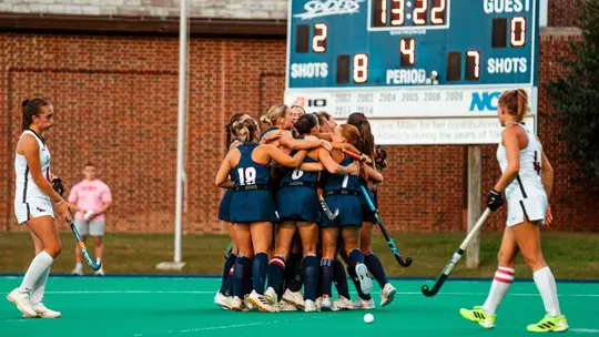 Spider field hockey celebrates scoring a goal against Saint Joseph's