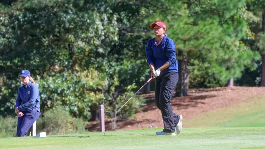 Maya Beasley holds her follow through after a tee shot