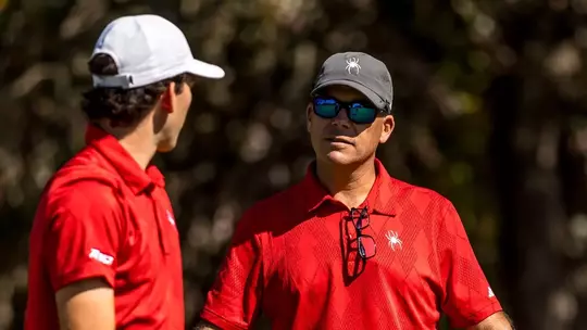 Coach Adam Decker stares at Lucas Rizo-Patron