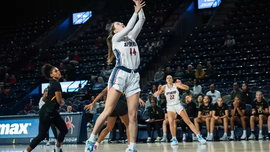 Doogan going up for a layup